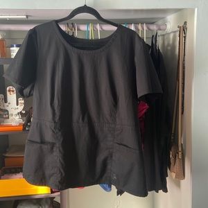 Jaanuu peplum top with gold zipper.